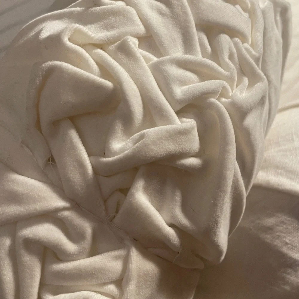 Round white velvet tufted pillow